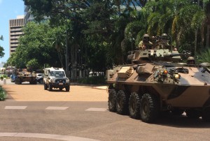 A convoy of police and Defence Force vehicles escort the Victoria Cross to Parliament House.